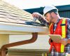 home inspector inspecting the roof and gutters