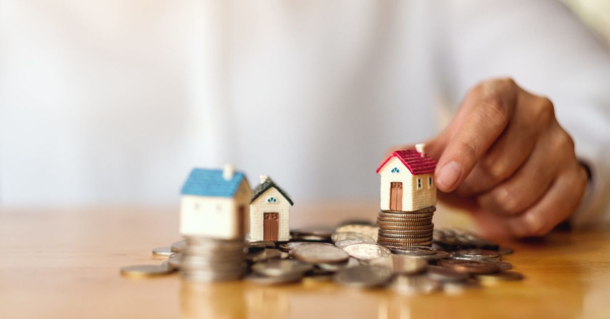 image of houses on top of money